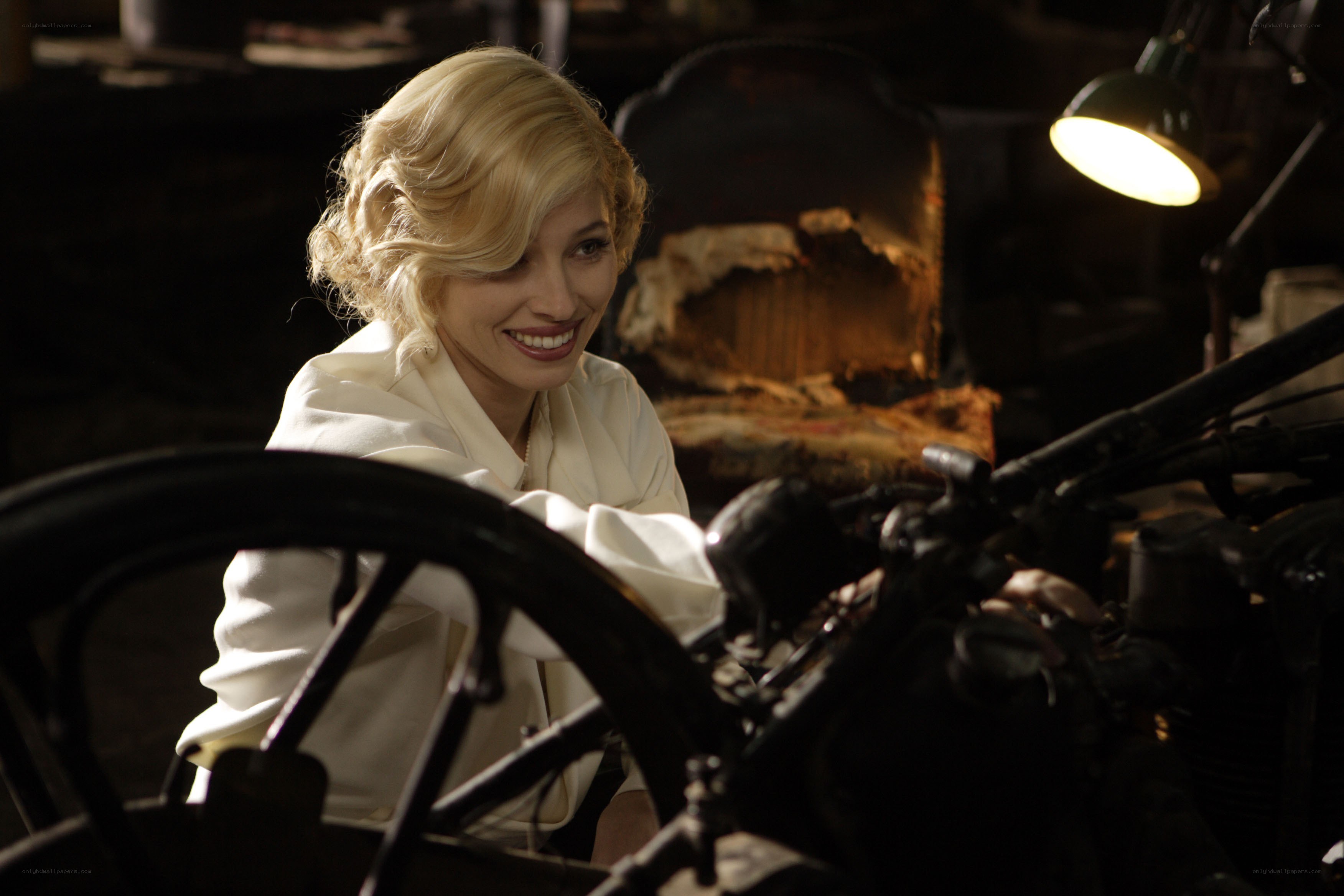 Woman in workshop with motorcycle