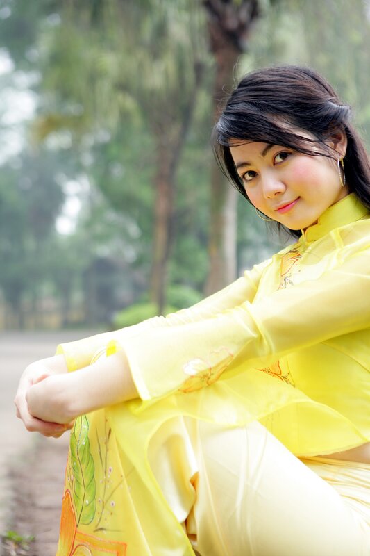 woman in yellow ao dai