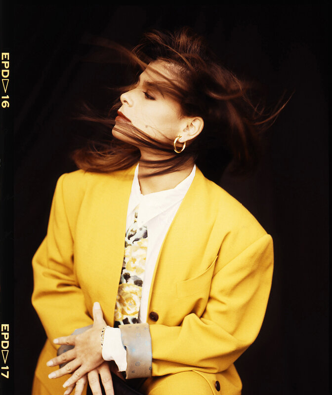 woman in yellow blazer