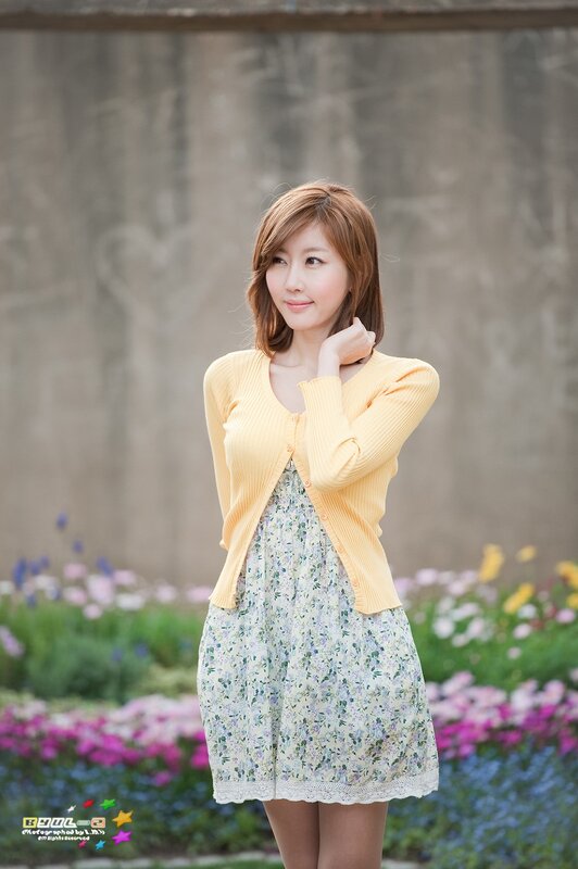 woman in yellow cardigan