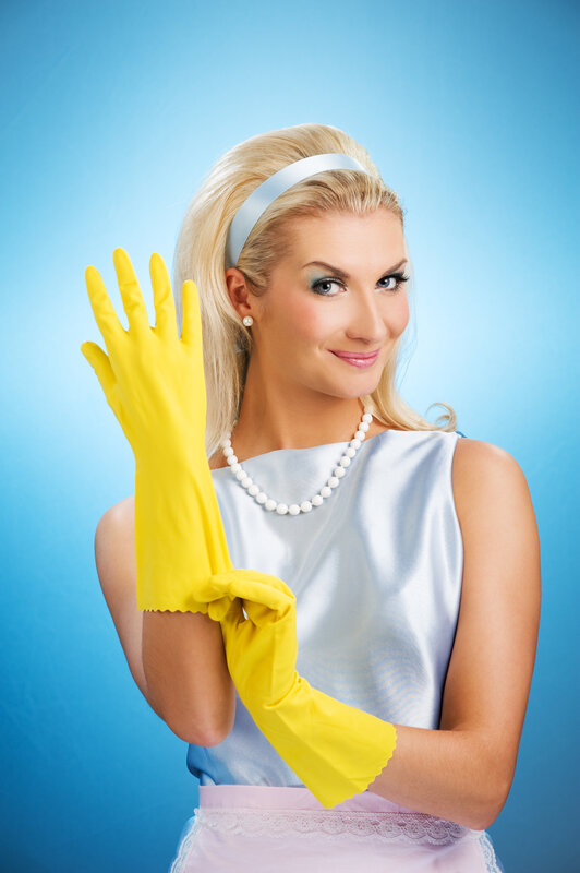 woman in yellow cleaning gloves
