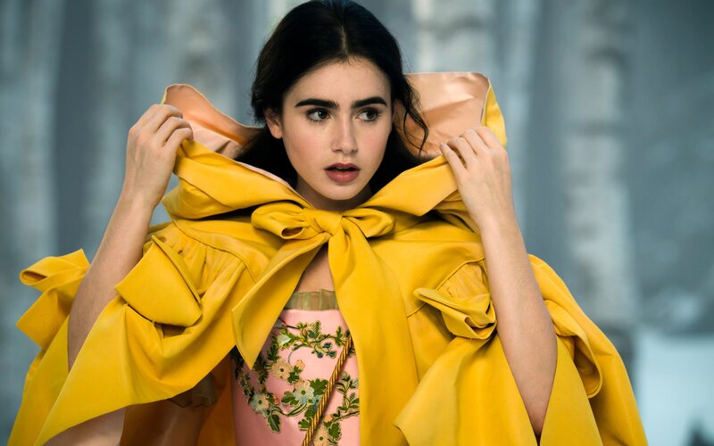 woman in yellow cloak