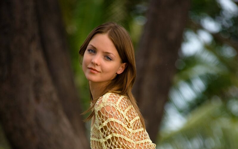 woman in yellow crochet top