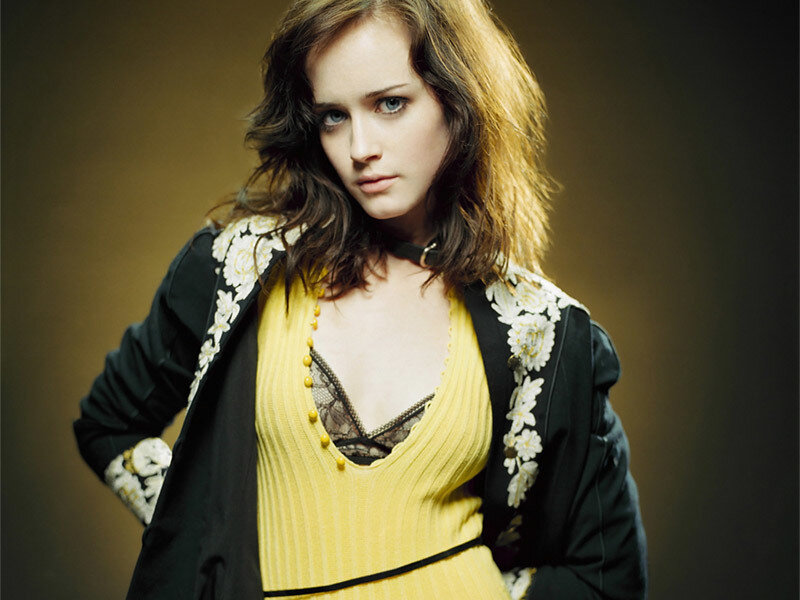 woman in yellow dress and black jacket