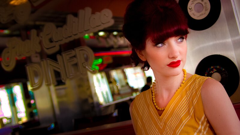 woman in yellow dress at diner