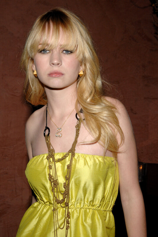 Woman in yellow dress at event