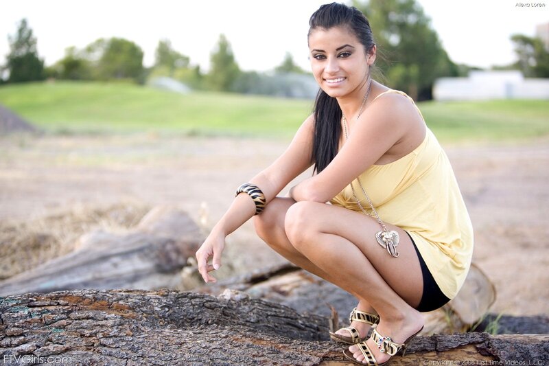 woman in yellow dress crouching
