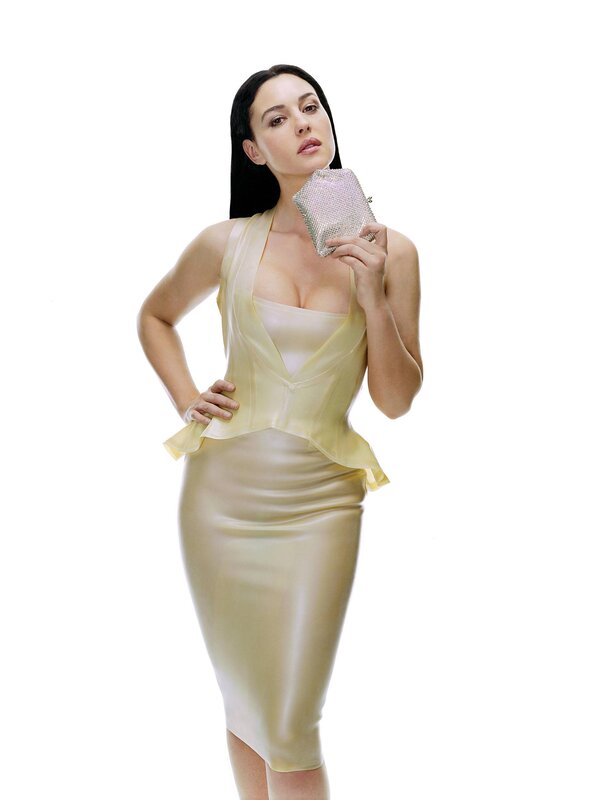 woman in yellow dress holding clutch