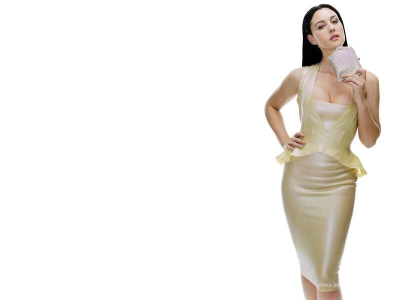 woman in yellow dress holding clutch
