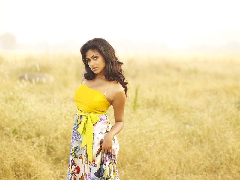 woman in yellow dress in field