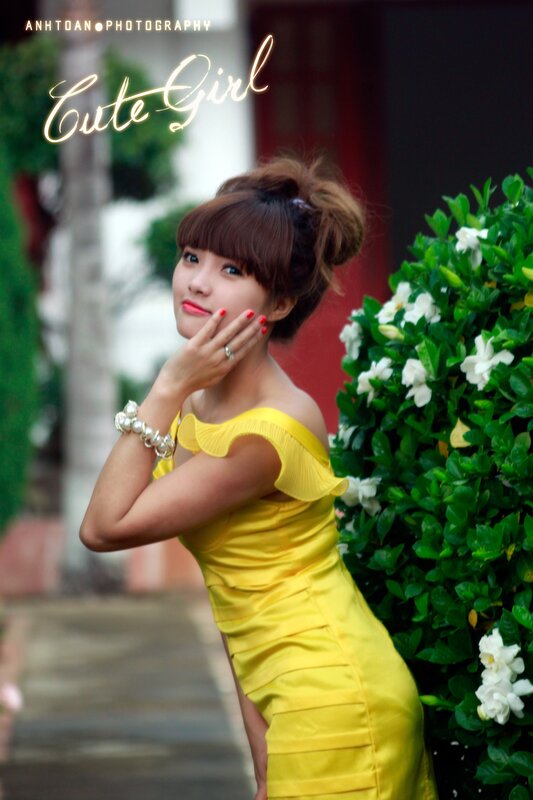 woman in yellow dress posing