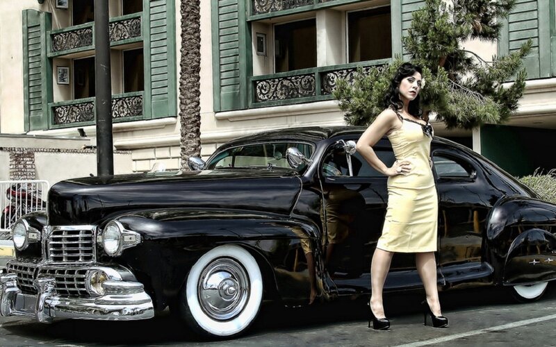 woman in yellow dress with classic car