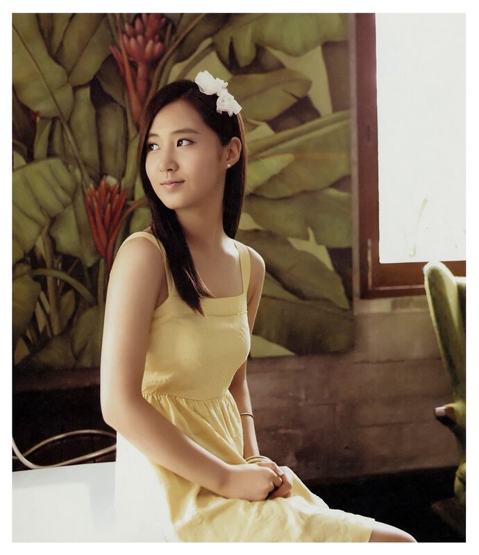 woman in yellow dress with flower