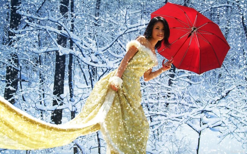 Woman in yellow dress with red umbrella