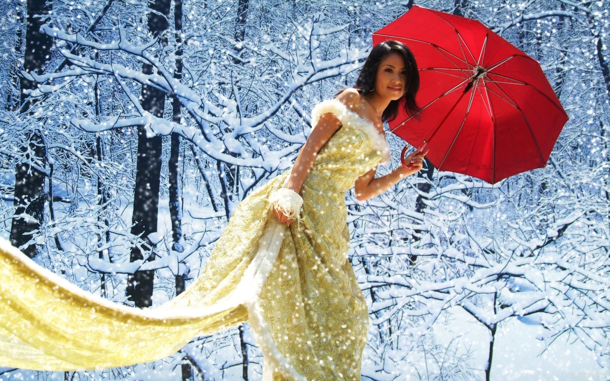 Woman in yellow dress with red umbrella