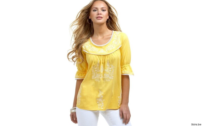 woman in yellow embroidered top