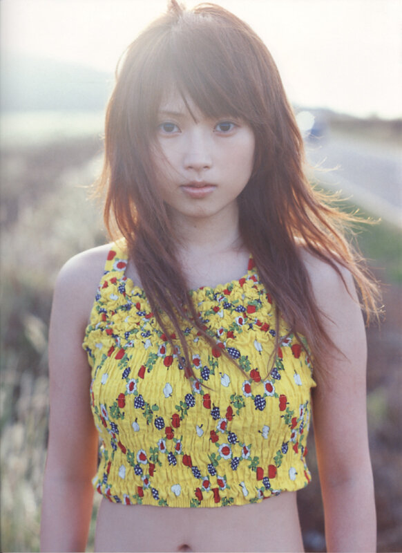 woman in yellow floral top