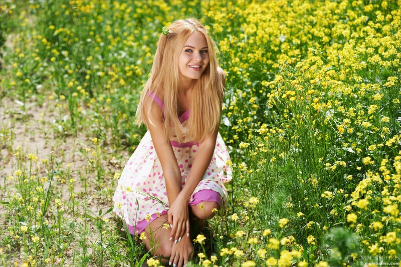 Woman in yellow flower field