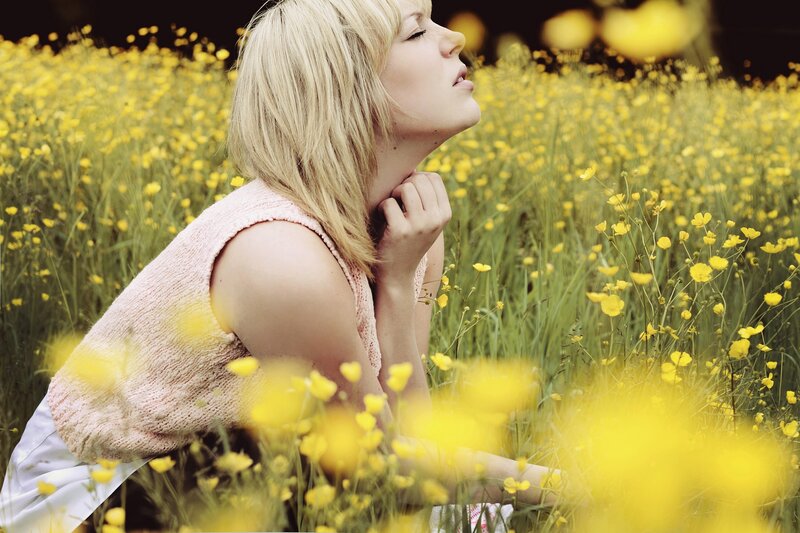 woman in yellow flower field