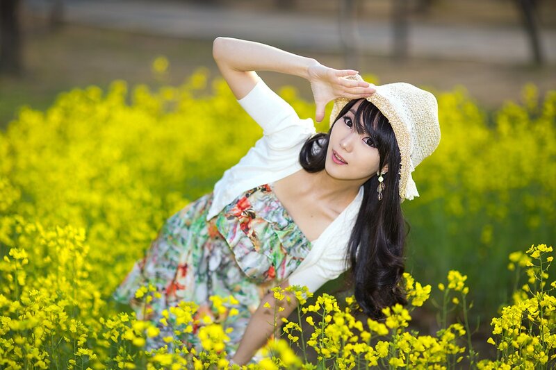 woman in yellow flower field