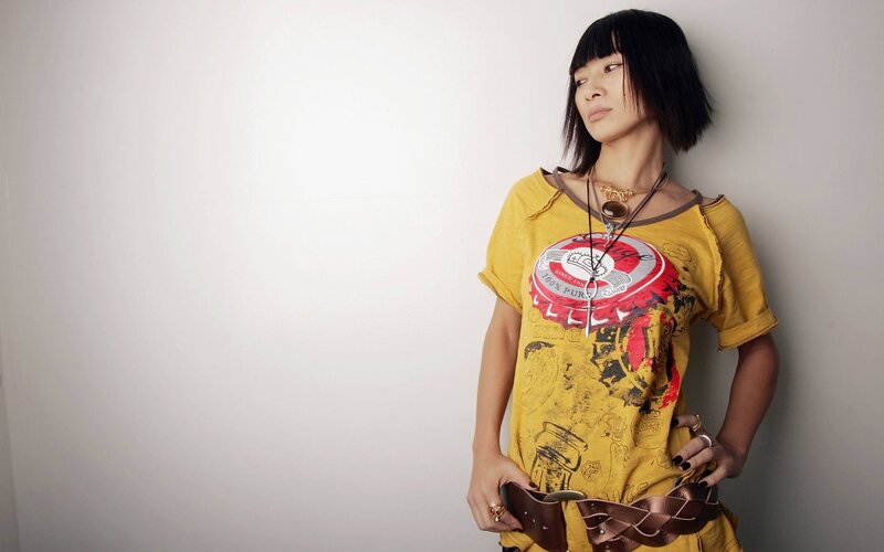woman in yellow graphic t-shirt