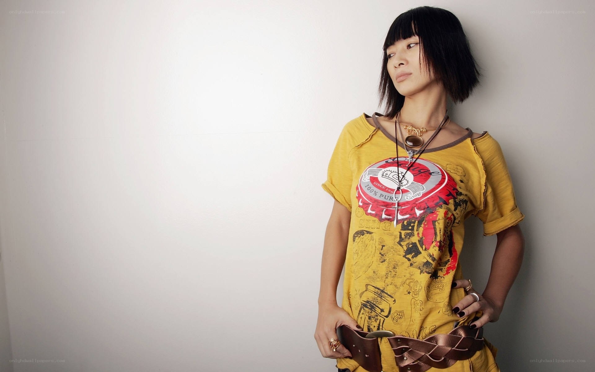 woman in yellow graphic t-shirt
