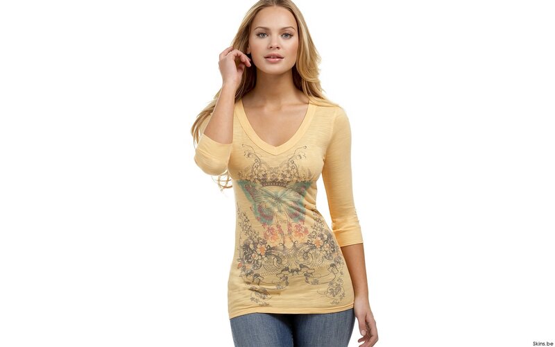 Woman in yellow graphic top