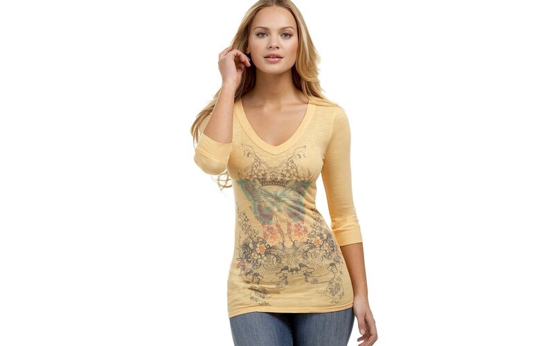woman in yellow graphic top