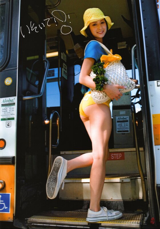 Woman in yellow hat on bus