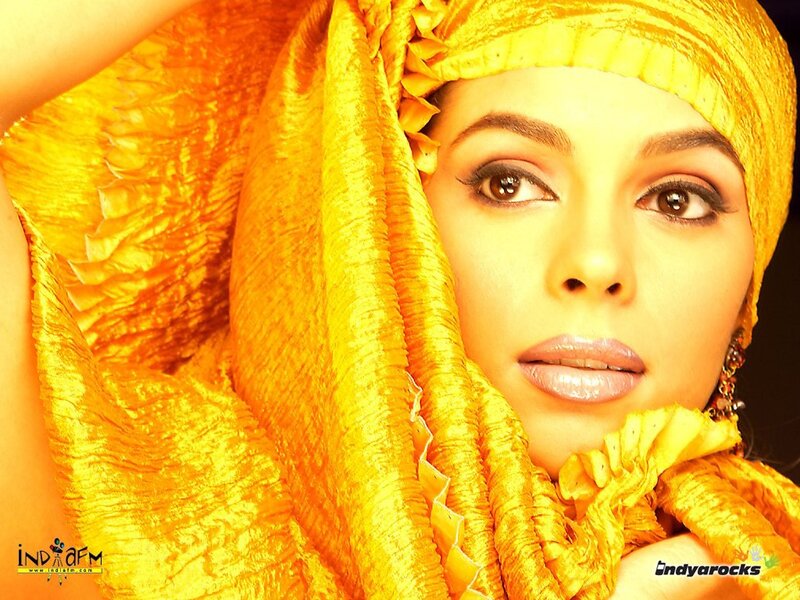 woman in yellow headscarf