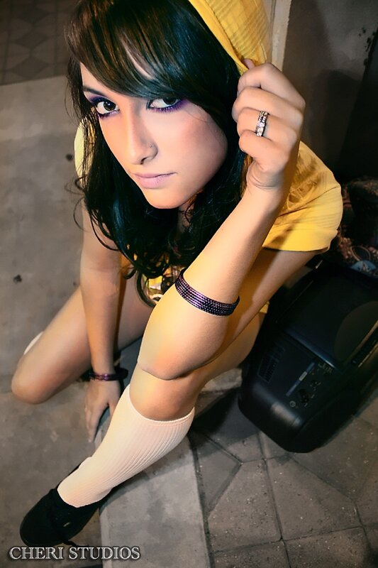 woman in yellow hoodie posing
