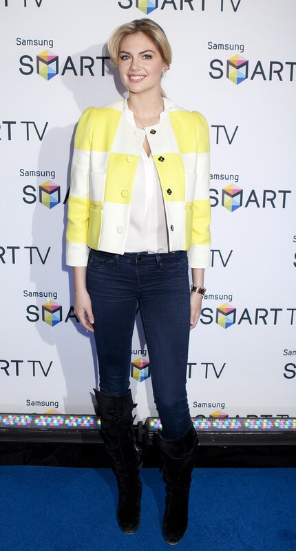 woman in yellow jacket at event