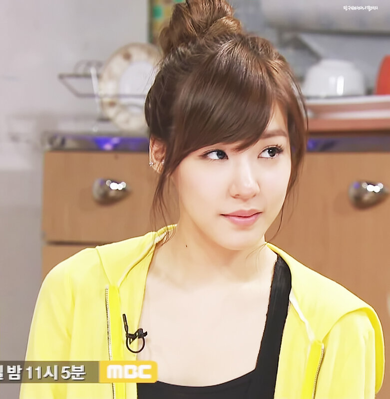 woman in yellow jacket on tv