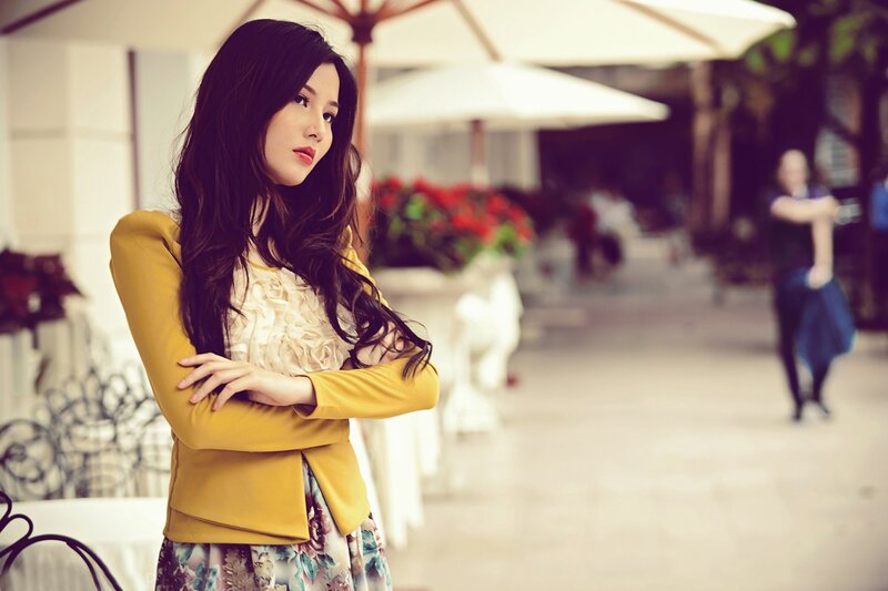 woman in yellow jacket outdoors