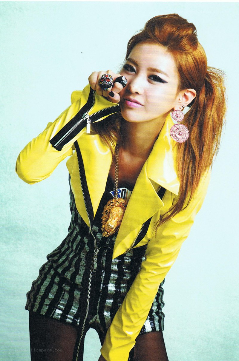 woman in yellow jacket posing