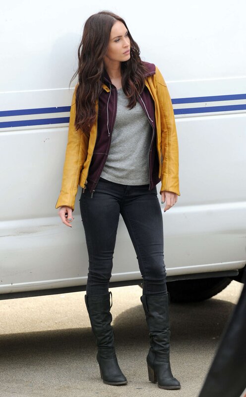 woman in yellow jacket standing