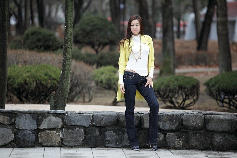 woman in yellow jacket standing