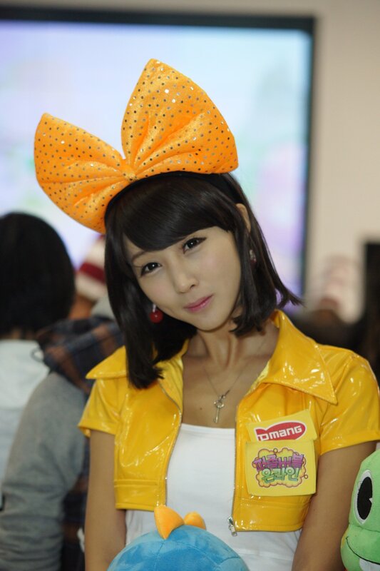 Woman in yellow jacket with bow