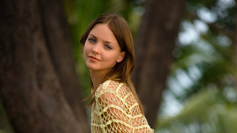 woman in yellow lace top