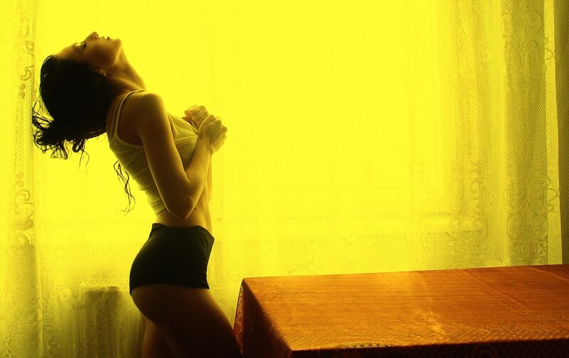 Woman in Yellow Light — Dramatic