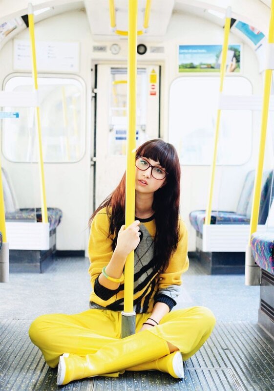 Woman in yellow on subway