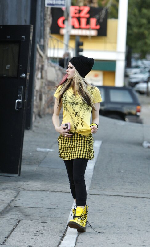 woman in yellow outfit walking