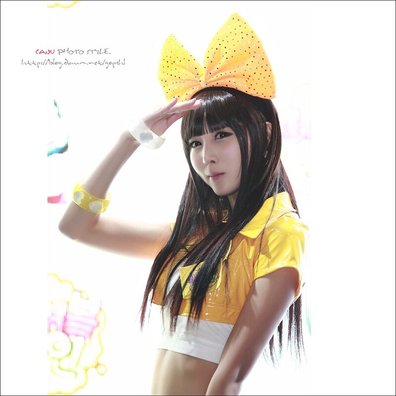 woman in yellow outfit with bow
