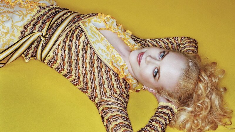 woman in yellow patterned dress