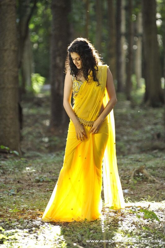 woman in yellow sari outdoors