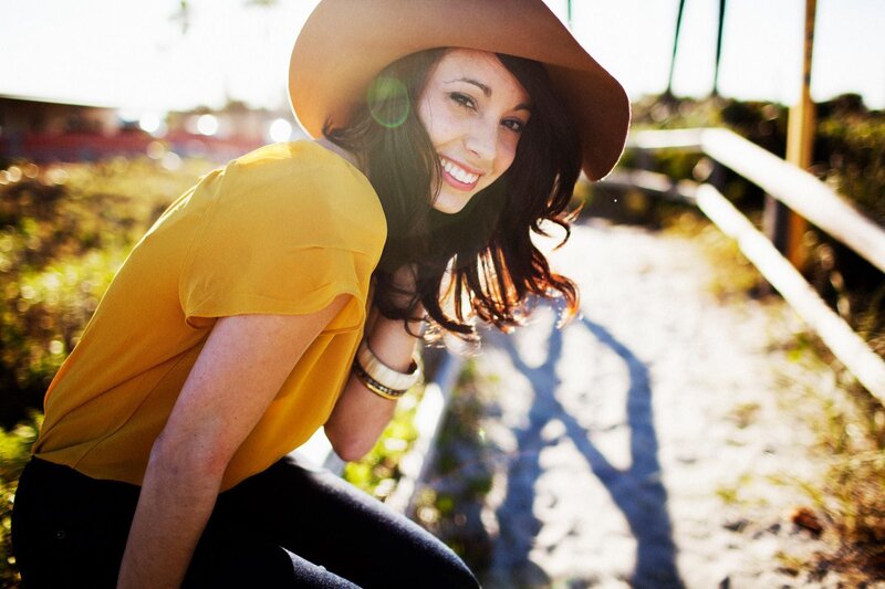 woman in yellow shirt and hat