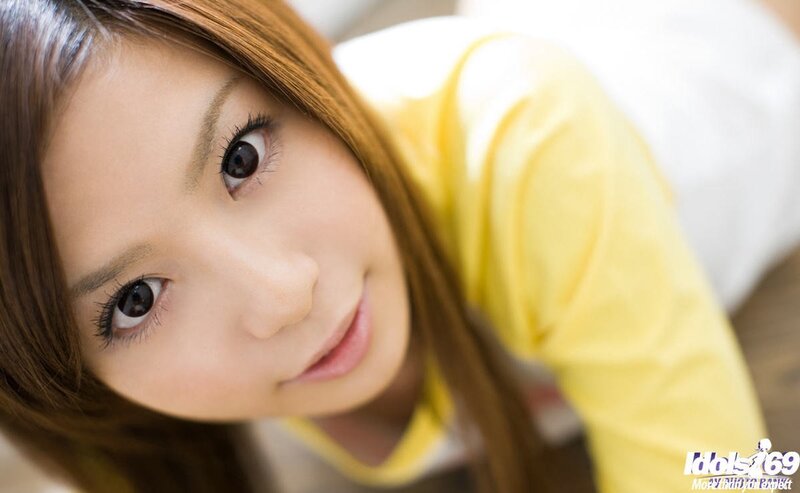 woman in yellow shirt looking up