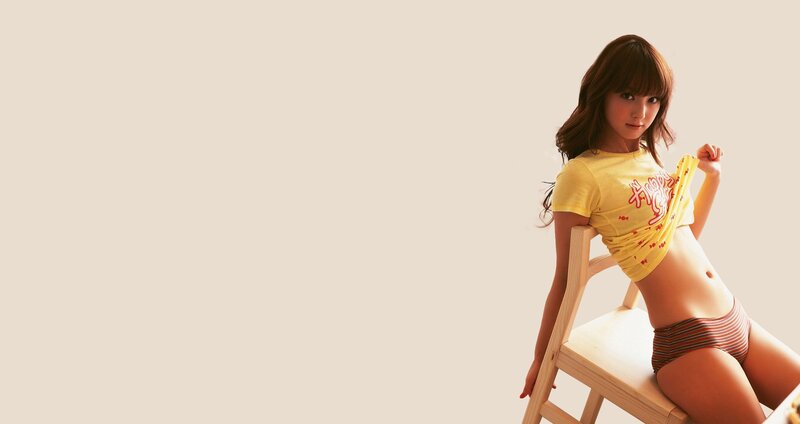 woman in yellow shirt on chair