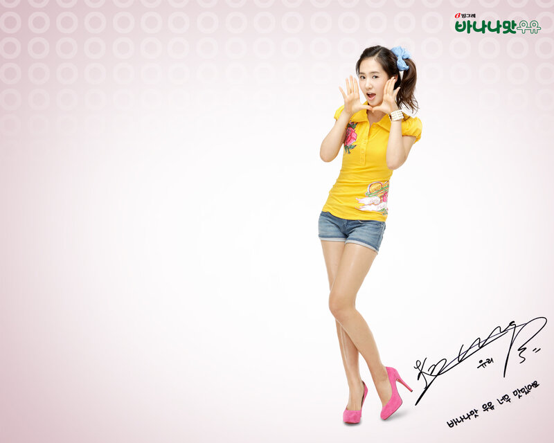 woman in yellow shirt posing