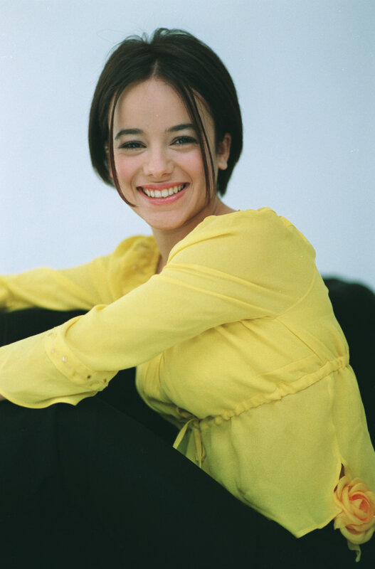 woman in yellow shirt smiling
